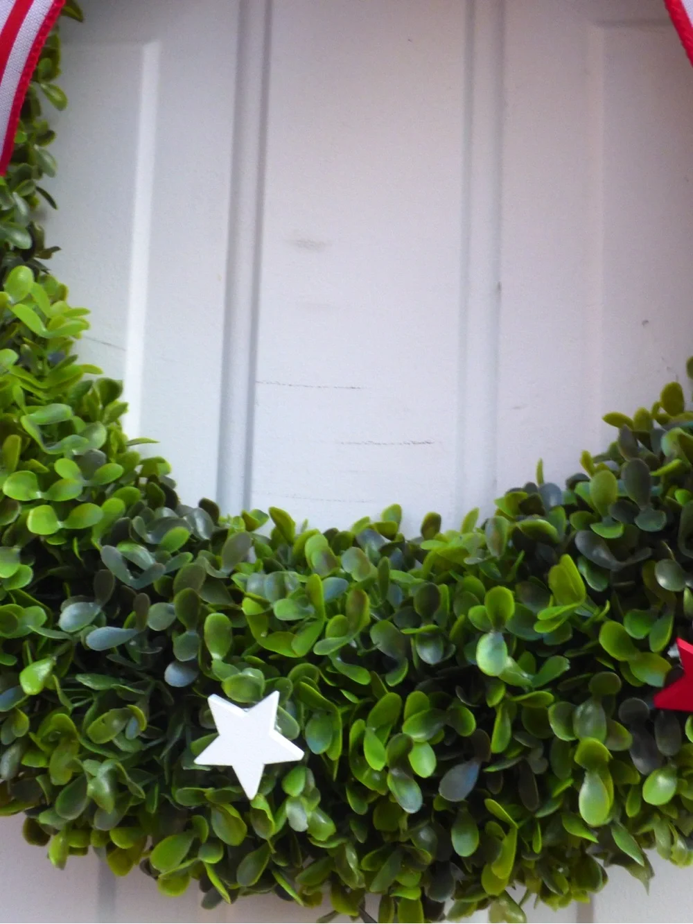 Patriotic Green Boxwood Wreath with Red White Blue Stars and Bow